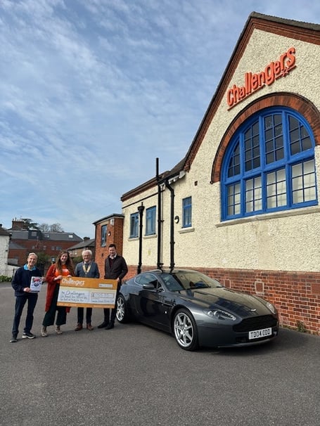 Members of Farnham Weyside Rotary present a donation to Challengers after the Farnham Festival of Transport.