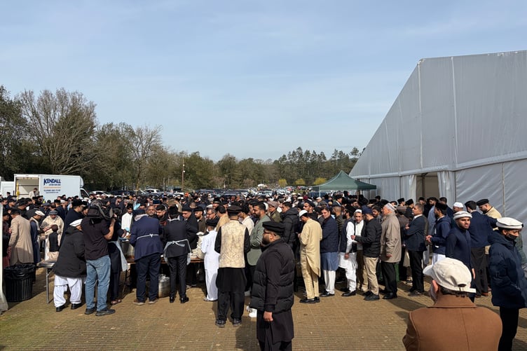 Food is served after prayers at the Eid Al-Fitr celebrations at Islamabad in Tilford.