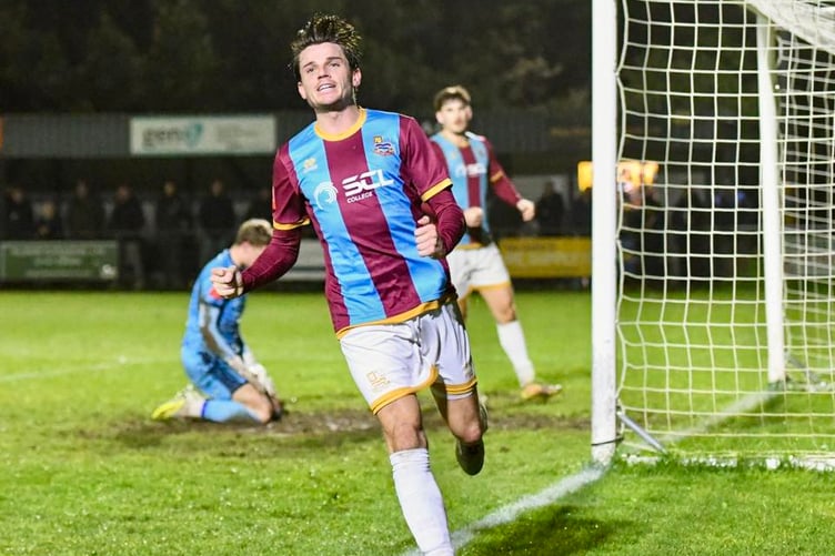 Seb Bowerman celebrates after giving Farnham Town the lead