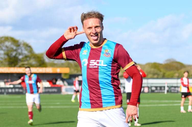 Adam Liddle celebrates after scoring Farnham Town's second goal