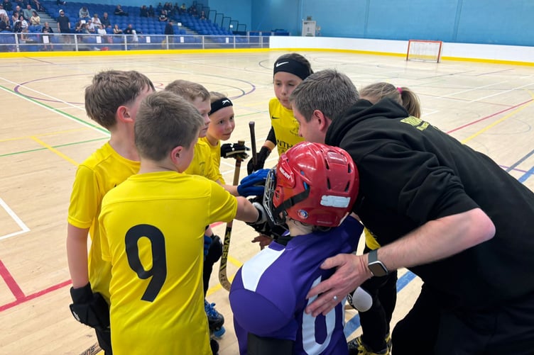 Farnham's under-11s have a chat with coach Greg Ashley-Buck