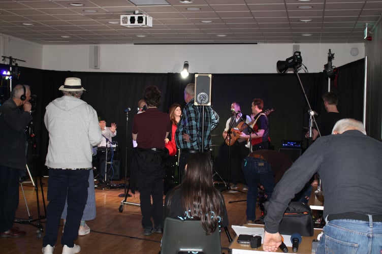 Members of the Surrey Border Movie Makers film the band Horizon, St Joan's Centre, Tilford Road, Farnham, April 10th 2026.