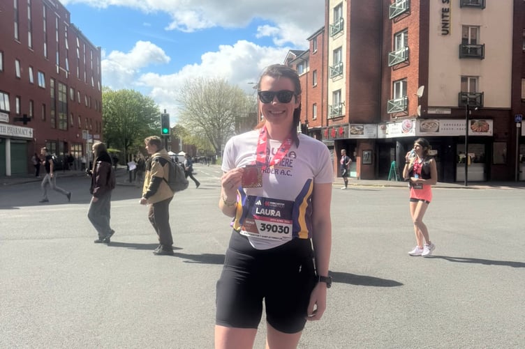 Laura Smith celebrates her personal best at the Manchester Marathon
