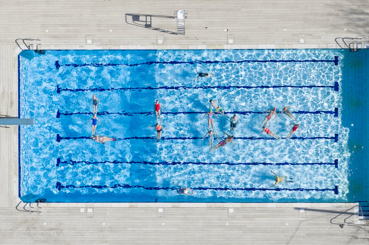 PETERSFIELD: Swimmers announce the new name of Petersfield Pool in Hampshire. The Pool has changed its name from "Open Air Pool" to "Lido" Photograph By Chris Gorman / BIg ladder