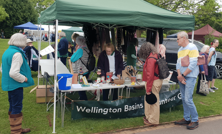 Wellington Basins Volunteer Group fund-raised with a bric-a-brac stall in the spring fair in the town's park.