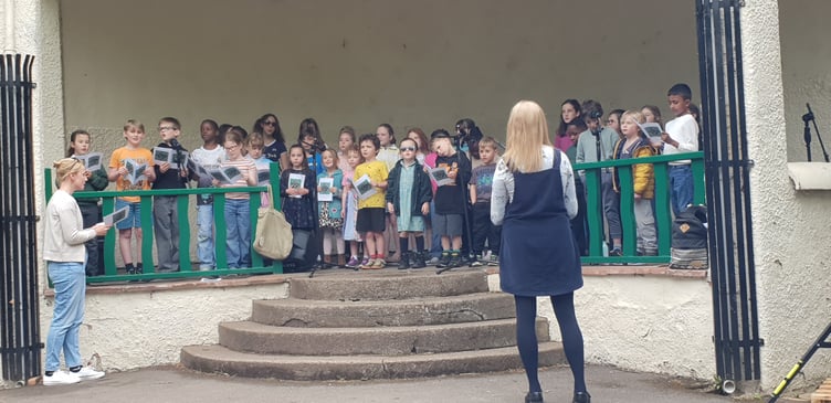 Beech Grove Primary School pupils singing in the bandstand of Wellington Park for crowds attending the annual spring fair.