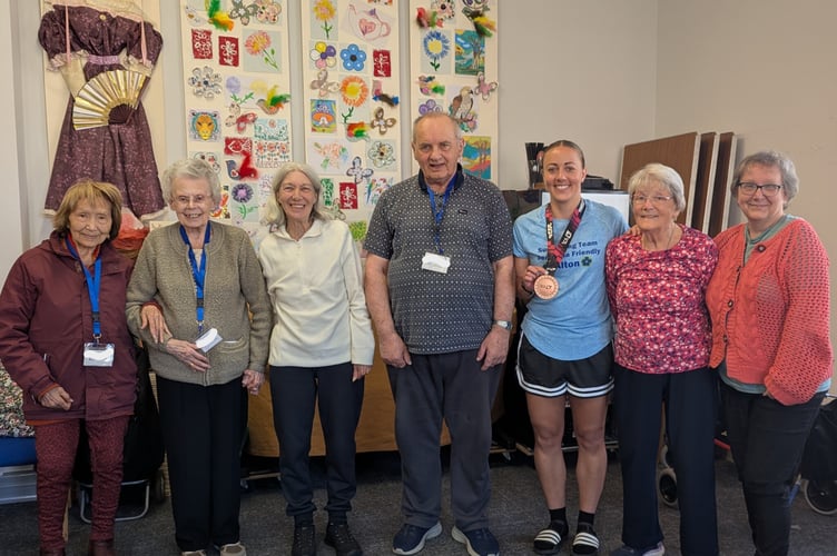 Charlotte Timms shows off her London Marathon medal at Dementia-Friendly Alton on April 28th 2026.