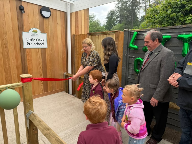 Kelly Stevens, Pre-School Manager and Lexi Stevens, Early Years Practitioner, cutting the ribbon to open Little Oaks Pre-School