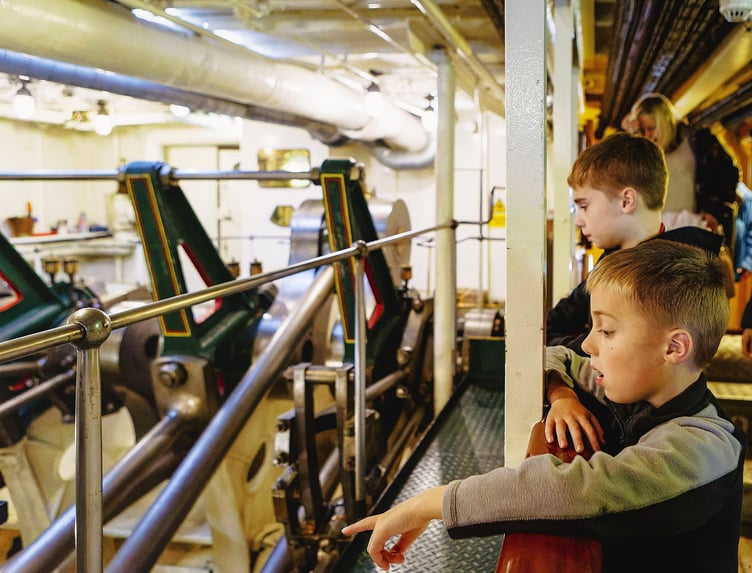 Passengers on board the ship can see the steam engine in motion.