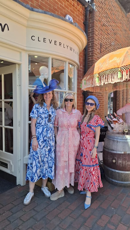 Harriet Cleverly, centre, and friends celebrating outside Cleverly Wrapped in Lion and Lamb Yard.