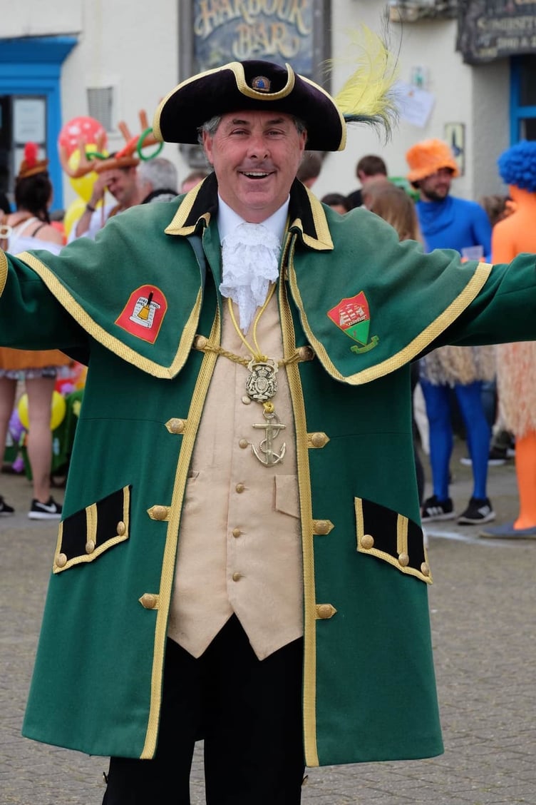 Watchet Town Crier David Milton in his over-size green regalia.