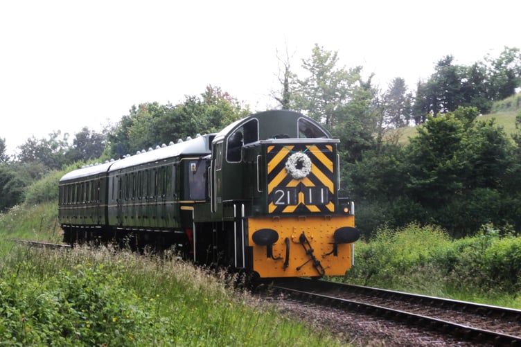 Diesel engine D2111 hauling passenger coaches during the West Somerset Railway's four-day summer festival. PHOTO: George Ody.
