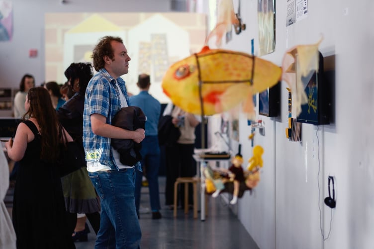 Guests looking at Exhibitions at the Farnham Grad Show 2026