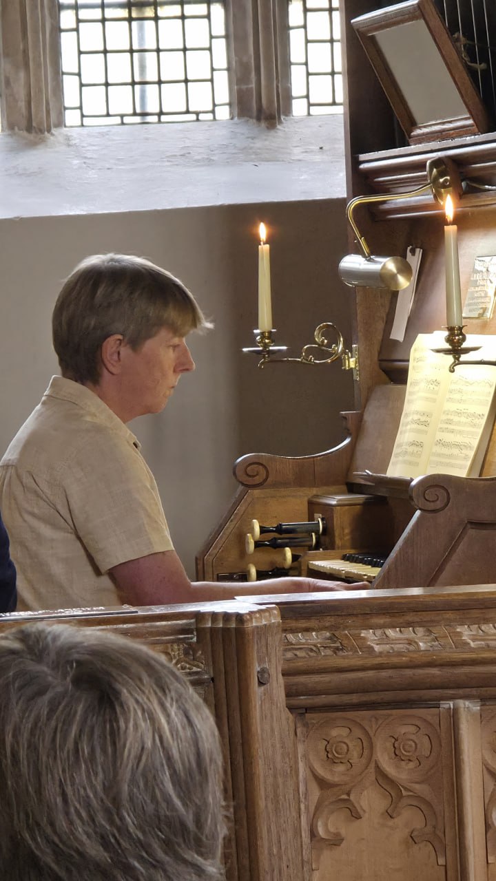 Choral Evensong organist Kate Hart in St Petrock's Church, Timbersocmbe.