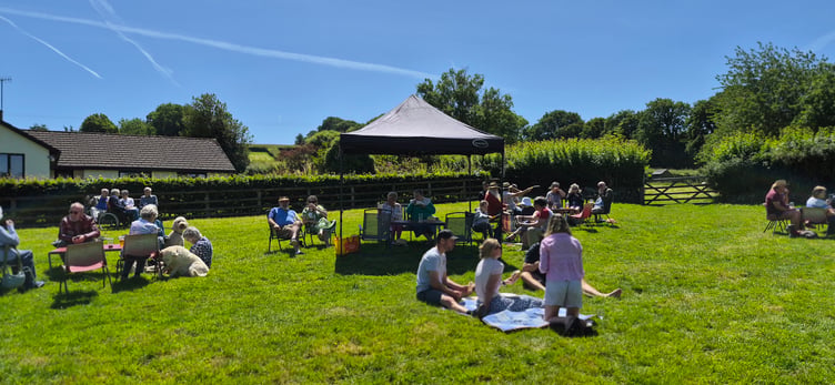 A scene from a family fun day and barbecue in Timberscombe to aid St Petrock's Church funds.