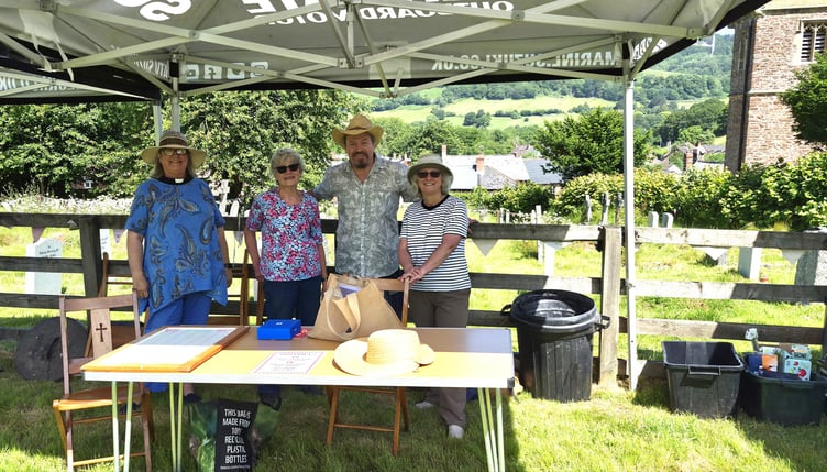 Timberscombe associate vicar the Rev Nichola Butt (left) and churchwarden Marion Jeffrey (right) check on the setting up of stalls for Timberscombe's patronal family fun day.