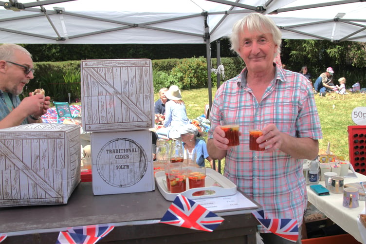 Paul Burnett at the Sampford Brett village fete cider stall. PHOTO: George Ody.