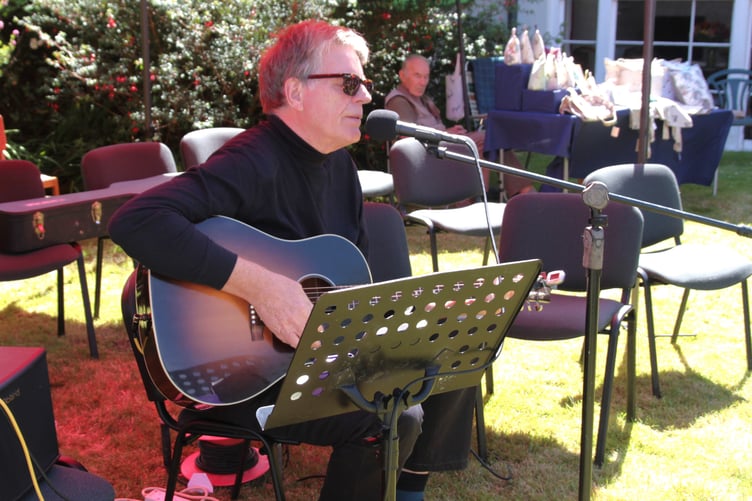 Sampford Brett village fete was fortunate 2026 was a fallow year for Glastonbury Festival as guitarist Peter Krigsman attended to entertain visitors. PHOTO: George Ody.