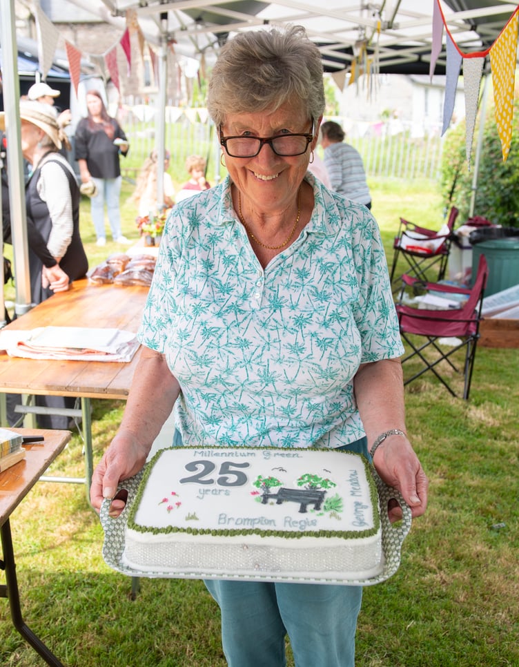 Jenny Stringer with the Brompton Regis Millennium Green 25th anniversary cake she made. PHOTO: Dale Cherry.