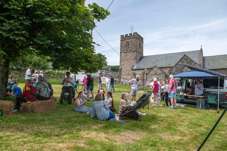 Brompton Regis villagers celebrate their Millennium Green's 25th anniversary in the shadow of the parish church. PHOTO: Dale Cherry.