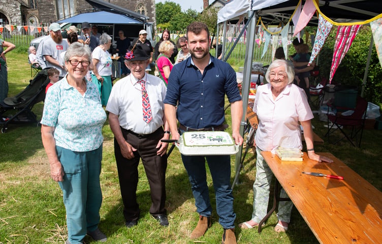 A 25th anniversary cake was baked to help Brompton Regis villagers celebrate a quarter of a century of Millennium Green community ownership, as displayed by (left to right) Jenny Stringer, Alan Wilson, Sam Cowling, and Babs Page. PHOTO: Dale Cherry.