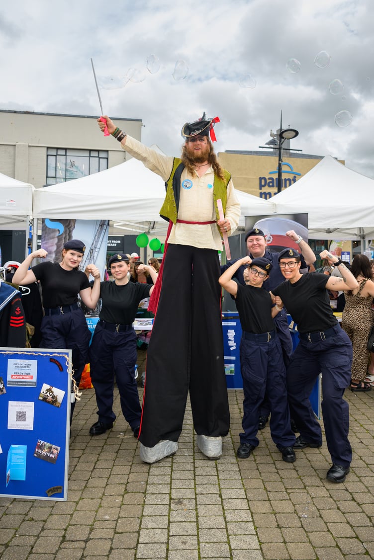 A stilt-walker joins Truro Sea Cadets during Truro's Childrens Day on Saturday, June 30, 2026 (Picture: PR4Photos/Truro BID)