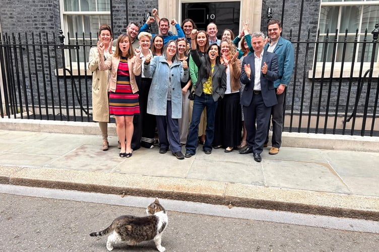Farnham parents celebrate outside No 10 Downing Street after the success of the Smartphone Free Childhood campaign, joined by Larry the cat.