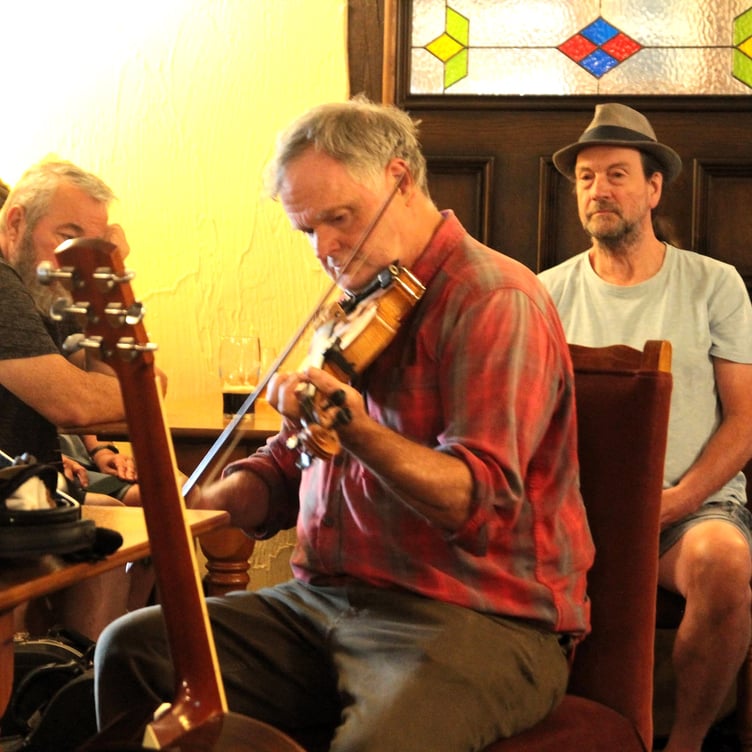 American Dave Sherman, from Roadwater, performs during the folk festival's 'American Session' in the Butchers Arms pub, Carhampton. PHOTO: George Ody.