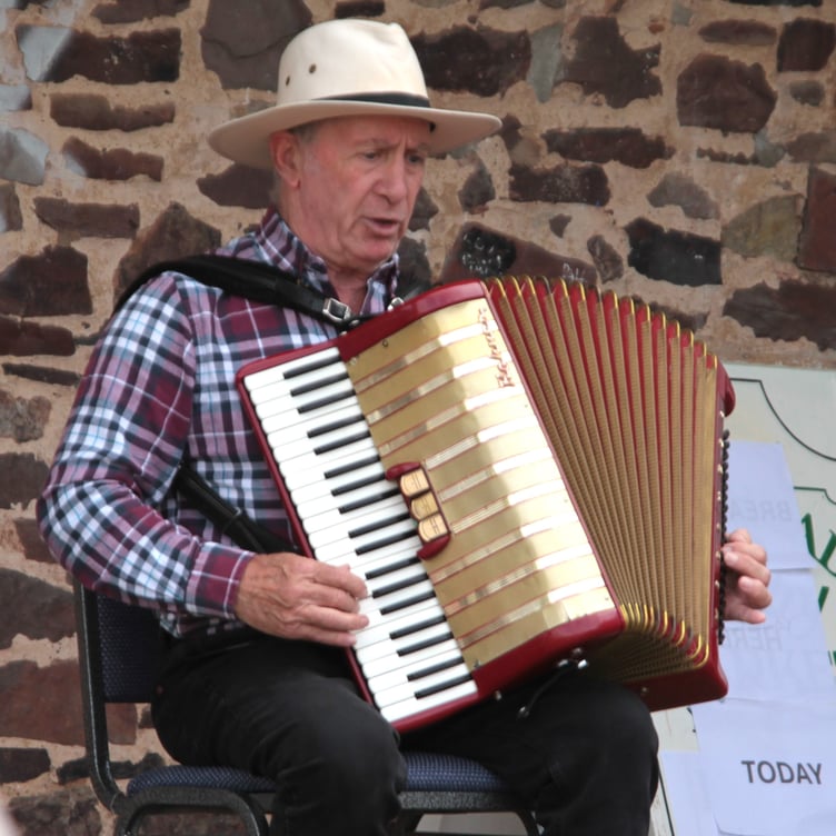 Mark Misko, from Black Country, entertains with his piano accordian at the South West Folk Festival in Carhampton. PHOGTO: George Ody.