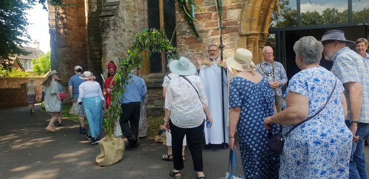 Visitors make their way around St John's Church for the 'clipping the tower' ceremony.