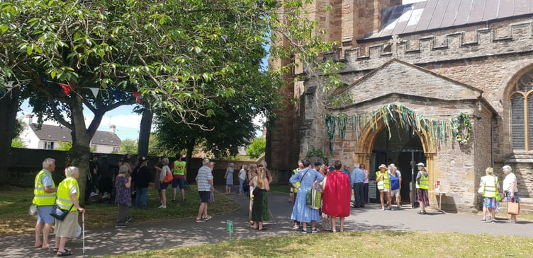 People start to gather outside St John's Church to take part in 'clipping the tower' on Saturday.