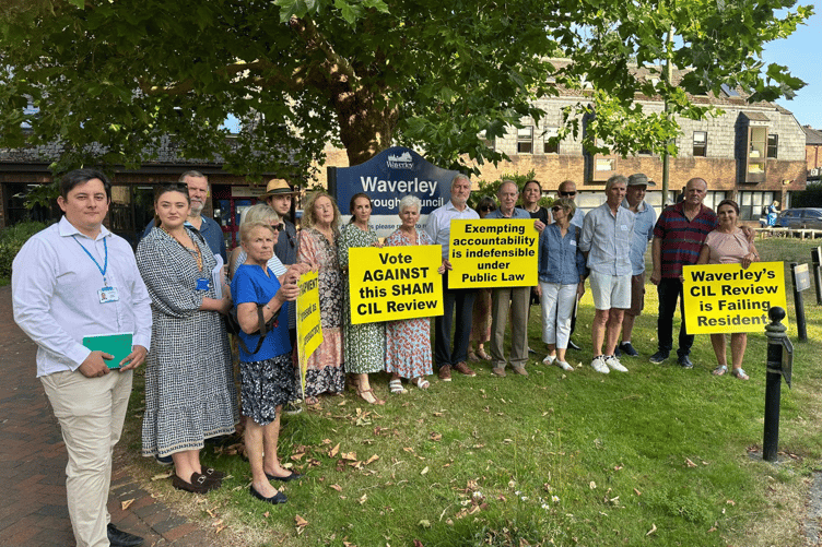 Opponents to Waverley Borough Council's handing of its CIL review process outside the civic centre in Godalming