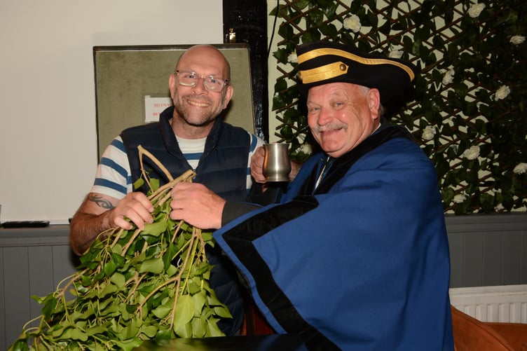 Richard Brown, the Portreeve awarding the fair ivy to Spencer Lee of the Crown and Spectre (Picture: Rodney Parrish)