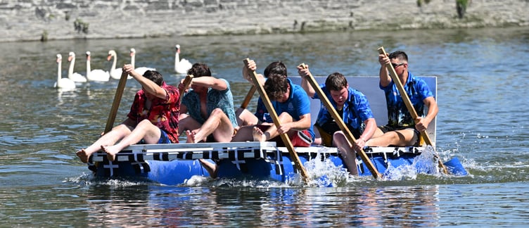 St Mabyn YFC found themselves in a race with a group of swans in the Wadebridge water (Picture: Adrian Jasper)