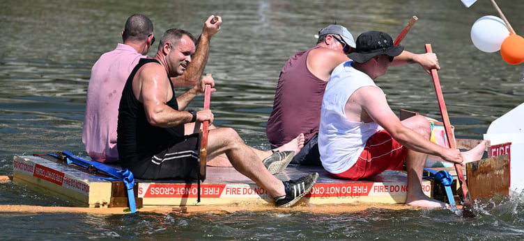 Wadebridge's fire fighters are never far from water in work, but their entry into the raft race took them even closer (Picture: Adrian Jasper)