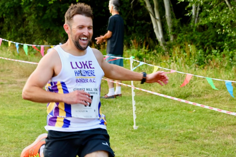 Luke Etheridge crosses the finish line