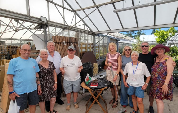 The charity’s weigh in team (L-R): members John and Di Taylor, Trustees Neil Gregory and Nigel Dancer, Chair Jacky Miles MBE, fundraiser Andrea Davies, Membership Secretary Kath Cleveland, Trustee Gareth Davies and fundraiser Denise Dancer.