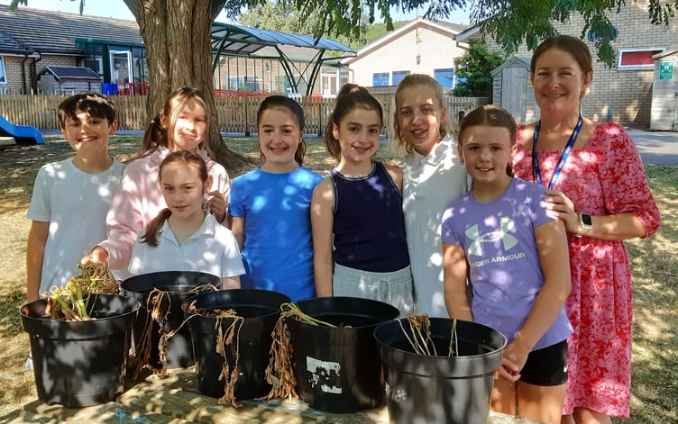 Llangattock Church In Wales School head Mrs Katherine Durbin with some of the children who took part in this year's challenge. All 5 classes competed, with Year 6 taking the top honours in the inter-class contest with 225g.