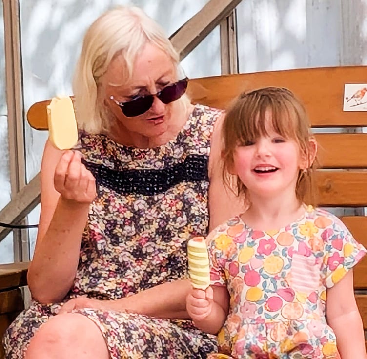 Mabel enjoying a reward with Great Aunt Julie Evans after the weigh in.