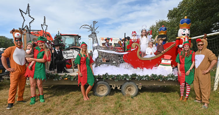 Christmas Lights arrives early in St Teath as the Johnson, Sleep and Elston families take this years new trophy "The Pearl Cory MBE and Bonzo Memorial Cup for Best Overall winner in the carnival (Picture: Adrian Jasper)