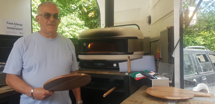 Dom Perry prepares to serve up 'A Pizza Heaven' for Wellington's Old Vicarage residents as they celebrated the 70th anniversary of the Abbeyfield Society.