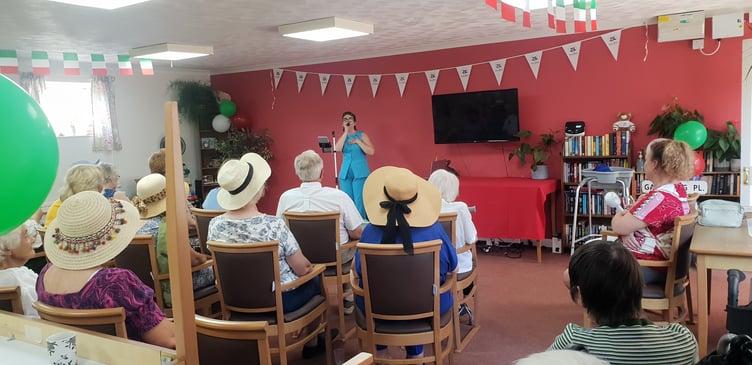Singer-songwriter-actress Kiera Chard entertains residents of Wellington's Old Vicarage Abbeyfield home for a 70th anniversary party.