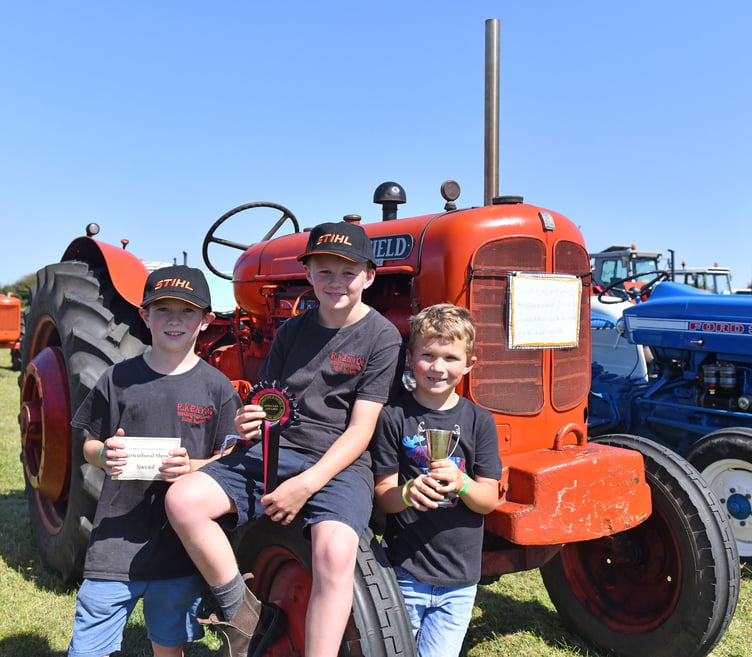 Matthew, Edward and James Kenyon of Boscastle delighted to take first prize for under 13's Vintage Tractor a 1953 Nuffield Universal (Picture: Adrian Jasper)