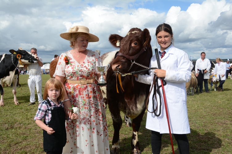 Mrs Angela Blackman presenting a trophy for one of the prize winning bovines (Picture: Rodney Parrish)