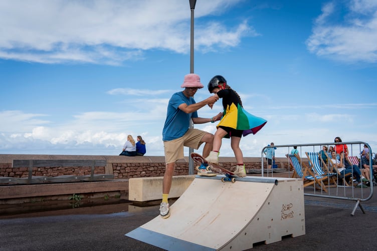 A youngster tries out skateboarding during Minehead Bay Festival. PHOTO: James Aitken.