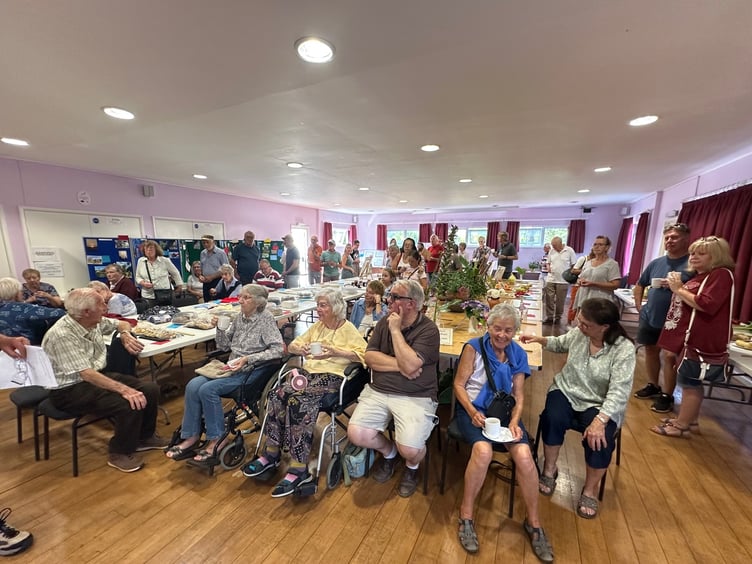 Some of the exhibitors and visitors relaxing with a cuppa at this year's Timberscombe Show. PHOTO: Gabrielle Horrobin/Jane Daniels.