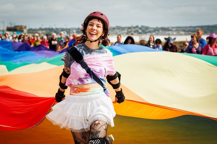 Leading the Cornwall Pride flag along Penzance seafront at Penzance Pride 2026, on September 12.