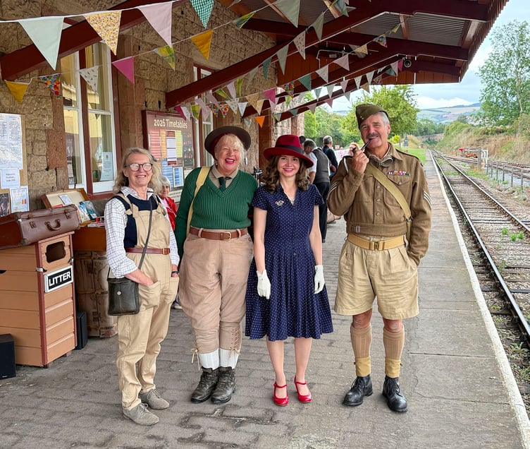 Awaiting the next train to arrive at Washford Station during the annual Forties weekend festivities . PHOTO: Tim Wetherell.