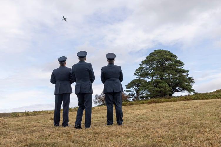 A Spitfire gave a display in the skies above Crowcombe as an 80th anniversary memorial service was held for nine RAF crew killed in a crash on the Quantocks.