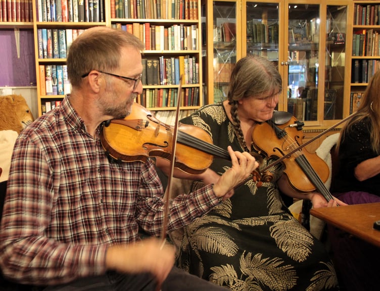 Two players in the popular folk group Fitzwarren Collective, who performed in the Cramptonbury festival's Reading Room. PHOTO: George Ody.
